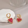Gold heart drop earrings with pink enamel texture on a minimalist display stand - Heart Enamel / Gold Red