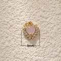 Macro detail of 18K gold plated heart pendant with pink gemstone and 9mm width scale - Rose Quartz Heart Zircon Pendant