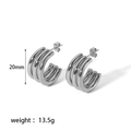 Macro view of silver triple-hoop C-shaped earrings showing 20mm height and metal texture - Triple Circle Hoop Silver (TE6253-S)