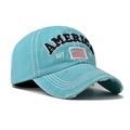 Detail of teal washed cotton baseball cap with American flag patch and worn-out brim - Adjustable / Fruit Green