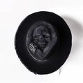 Black felt cowboy hat with 3D skull relief crown and black and white paisley band - Skull Hat