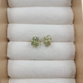 Handcrafted four-prong earrings with light green raw stones and gold wire wrap details - Peridot