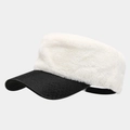 Detail of white plush crown and black leather brim on a contrast baker boy hat - Beige