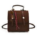 Brown faux suede backpack with vintage key charm and decorative braided ropes on white background - With Pendant / Brown