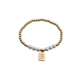Detail of beaded bracelet with gold beads, white pearls, and gold square S letter charm - Letter S