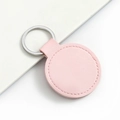 Pink round leather car keychain with silver metal ring and minimalist business style - Round / Light Pink