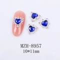 Macro detail of blue heart nail charms with hollow silver frame and crystal accents - Silver Base Blue Heart Style (8957)