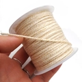 Detail of three-strand braided beige cotton cord on a white plastic spool - Approx. 2.0mm / Off White