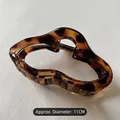 Detailed view of 11cm amber tortoiseshell hair claw clip with durable spring and LCP engraving - Leopard Print
