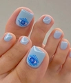 Light blue press-on toe nails featuring a hand-painted blue eye pattern on the big toe - 1671-Blue Eye Graffiti