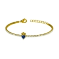 Golden tennis bracelet with heart-shaped blue sapphire and crown charm detail - Gold Blue Zirconia