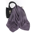 Detailed view of dark purple satin scarf draped on a handbag showing silky texture - One Size / Faux Silk Satin / Deep purple