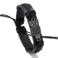 Detail view of retro braided PU leather bracelet with vintage owl metal charm and cord - Owl