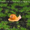 Miniature garden snail resin ornament with orange shell, size 2.7x1.2x1.4cm weight 4g - Snail