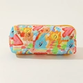 Close-up of quilted floral cotton pouch with colorful patches and yellow zipper detail - Graffiti