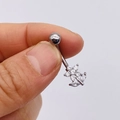 Close-up of silver stainless steel belly ring with sparkling zircon flower design - Silver Five-Petal Flower Style (JE0428I)