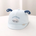 Detail of light blue baby cotton cap with happy puppy embroidery and cute soft 3D dog ears - 44cm (5-12 Months) / Blue