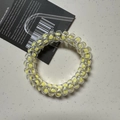 Elastic yellow telephone wire hair tie with a clover pattern and transparent spiral design - Polka Dot Yellow