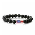 Macro shot of black lava stone beaded bracelet with rectangular American flag accent bead - Lava Stone Long