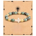 Detail of beaded baptism bracelet with green stone beads and white cross on a blessing card - Blue Jade + Cross