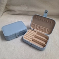 Light blue faux leather travel jewelry box showing both open and closed views - Single Layer Rectangular (Light Blue)