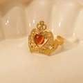 Macro detail of a gold crown ring featuring a central orange-red cat's eye gemstone - Orange Red Cat's Eye-Gold