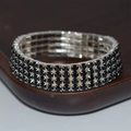Elegant four-row black rhinestone stretch bracelet with silver metal claw setting - 4 Row Silver Black Rhinestone Bracelet