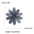 Elegant dark grey-blue acrylic flower brooch with textured petals and center rhinestone - Black
