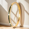 Elegant gold stainless steel bangle featuring continuous green square-cut gemstones - Square Decoration (44-E-5) / Gold Green Zirconia