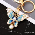 Colorful crystal butterfly keychain in blue and white enamel with gold lobster clasp - Blue Pearl Butterfly