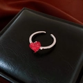 Detail view of a rose gold镂空 adjustable ring with cross pattern on black leather box - Cross Pattern Open Style (WR434)