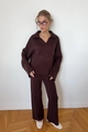 Detail view of coffee brown knit set featuring polo collar sweater and wide-leg pants - S / Coffee