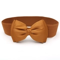 Close-up of caramel brown elastic waist belt with a large decorative satin bow detail - Camel