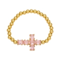 Beaded gold bracelet featuring a cross charm set with rectangular pink cubic zirconia - Pink