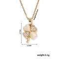 Detailed view of four-leaf clover pendant with cat-eye stones and 40+5cm chain - Gold Catseye Clover