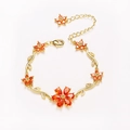 Gold flower bracelet with orange pear-shaped gemstones and white cubic zirconia accents - Gold-Orange