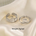 Set of two silver irregular wavy stainless steel rings with a 1.7cm inner diameter - Steel Color Jewelry Set