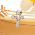 Silver cross stud earring with heart zircon and crystal inlay on a beige ceramic plate - Champagne (A233-4)