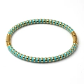 Detail of 5mm gold stainless steel bangle with blue enamel pattern and hidden clasp - Sky Blue