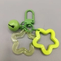 Green metal keychain with neon star pendants and matching bell accessory charm - Green