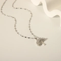 Silver tree of life pendant necklace with micro-set zircon on white minimalist background - Silver