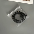 Portable thick EVA storage bag with black lightning cable and secure zipper closure - 50 Silk Transparent Zipper Bag / 13x13cm