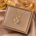 18k gold heart pendant necklace with colorful crystal and sequin chain on jewelry box - Gold Heart of the Sea