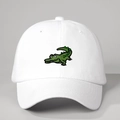 White cotton baseball cap with green cartoon crocodile embroidery and adjustable strap - White