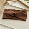 Detail of a wide brown twisted velvet headband displayed on a beige jewelry tray - Warm Brown