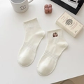 White cotton mid-calf socks featuring a cute brown bear embroidery and ribbed cuffs - Capybara - Peeking / 1 Pair