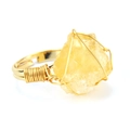 Detailed close-up of handmade wire-wrapped ring with irregular yellow raw stone - Adjustable Open / Citrine