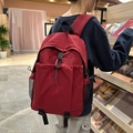 Zaino casual rosso scuro con tasca frontale a coulisse e tasche laterali in rete nera - Rosso