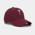 Detail of burgundy cotton baseball cap featuring white star cross embroidery texture - Burgundy