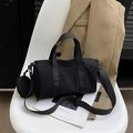 Minimalist black cylinder boston bag with adjustable strap and small round coin purse - Black
